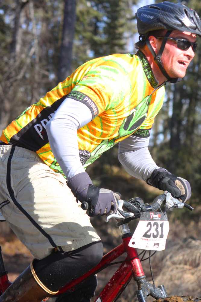 Photo by Kelly Sullivan/ Peninsula Clarion Anthony Murray rode through rough, muddy pools of melting ice on Wolverine trail, Saturday, April 19, at the Tsalteshi Trail.