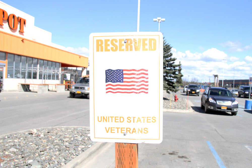 Photo by Dan Balmer/Peninsula Clarion American Legion representatives recognized the Kenai Home Depot for having a reserved parking spot for United States Veterans Thursday.