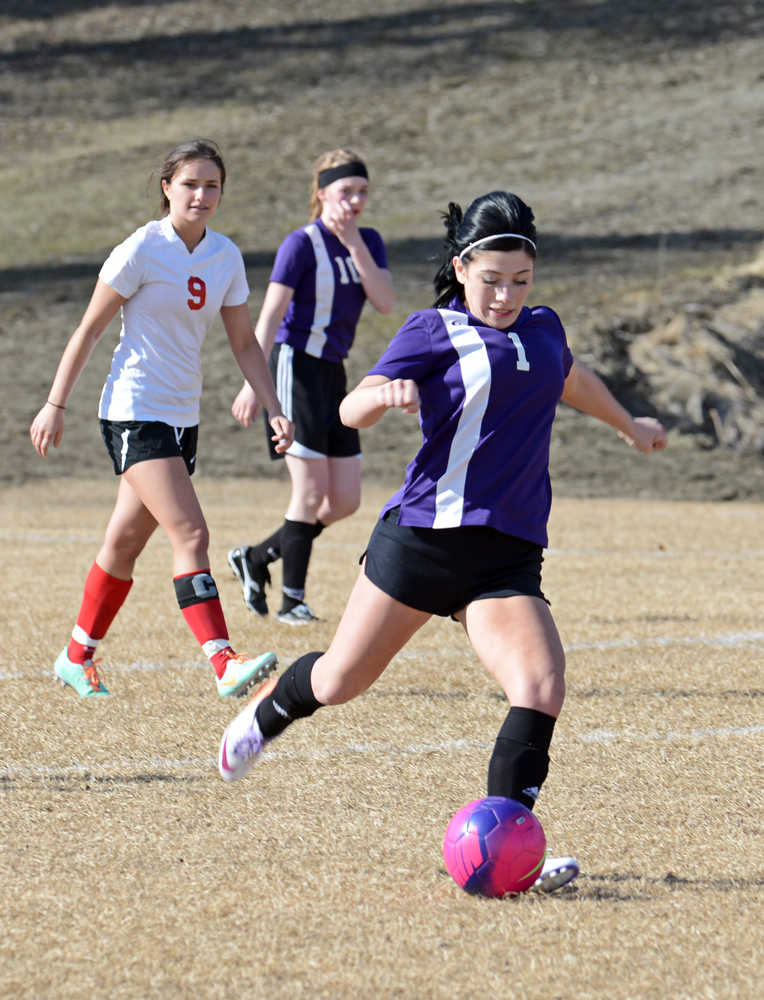 Photo by Rashah McChesney/Peninsula Clarion  Skyview's 1 sends the ball down the field during their game against Wasilla Thursday April 24, 2014 at Skyview High School in Soldotna, Alaska.