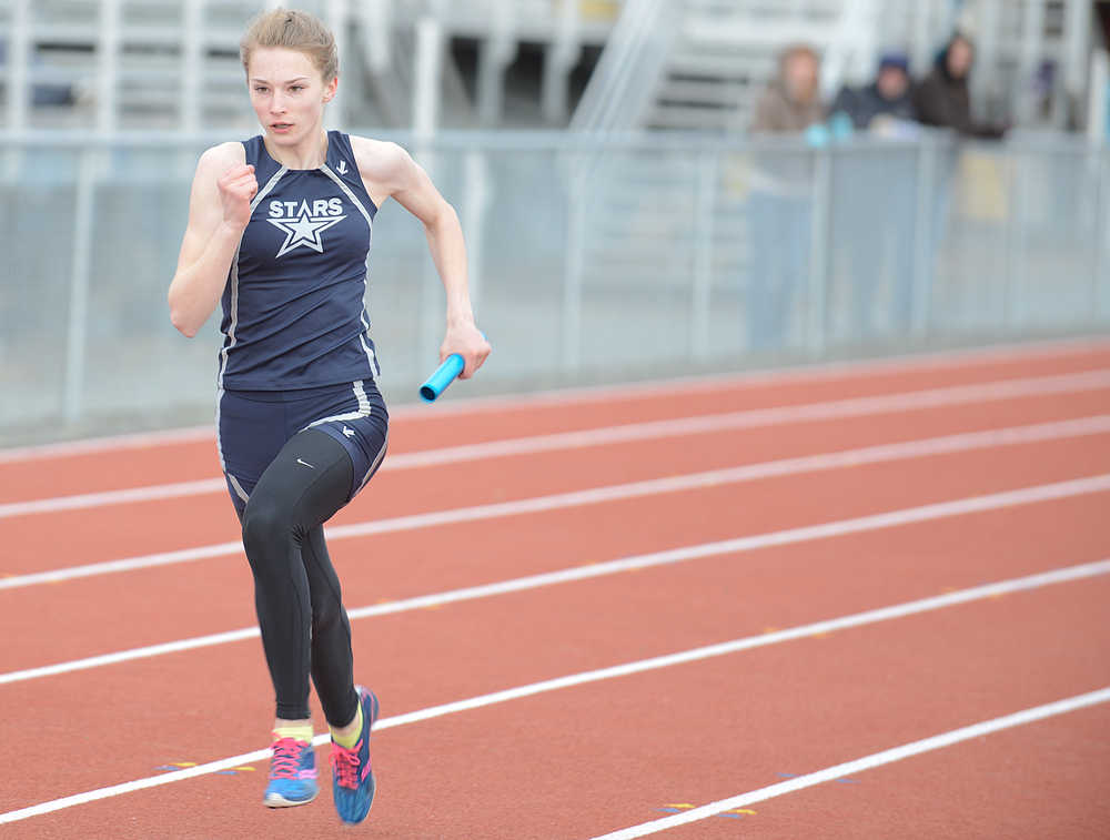 Photo by Rashah McChesney/Peninsula Clarion  Soldotna sophomore Daisy Nelson wins the final leg of a relay race Saturday April 26, 2014 during a track meet at Kenai Central High School in Kenai, Alaska.