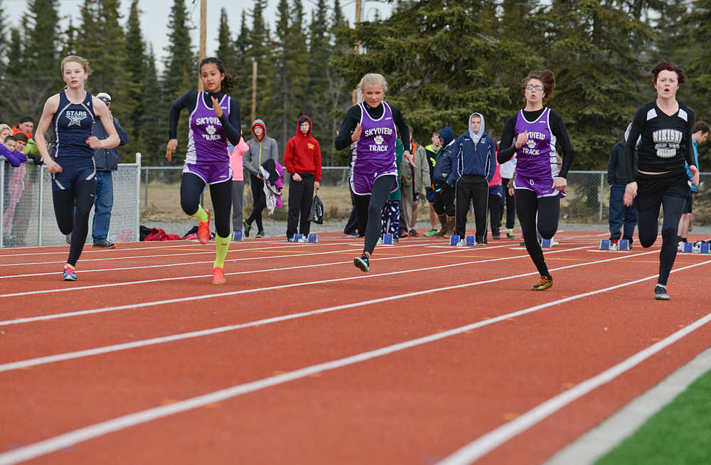 Photo by Rashah McChesney/Peninsula Clarion  Several runners take off during a track meet Saturday April 26, 2014 at Kenai Central High School in Kenai, Alaska.