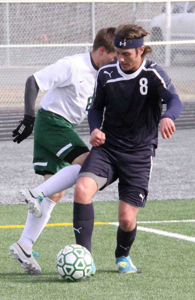 Soldotna's Jacob O'Lena takes the ball away from Colony's Cameron Shaw in the corner of the SoHi defensive third during the first half of a 3-0 loss to the Knights Friday in Palmer.