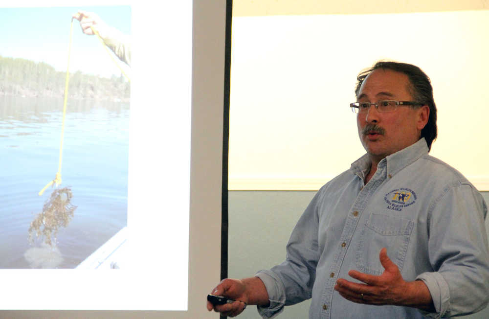 John Morton, supervisory fish and wildlife biologist with the Kenai National Wildlife Refuge, discusses the elodea eradication project for Beck, Daniels and Stormy lakes in the Nikiski area at a meeting at the Nikiski Community Recreation Center in Nikiski on Thursday. Photo by Kaylee Osowski/Peninsula Clarion