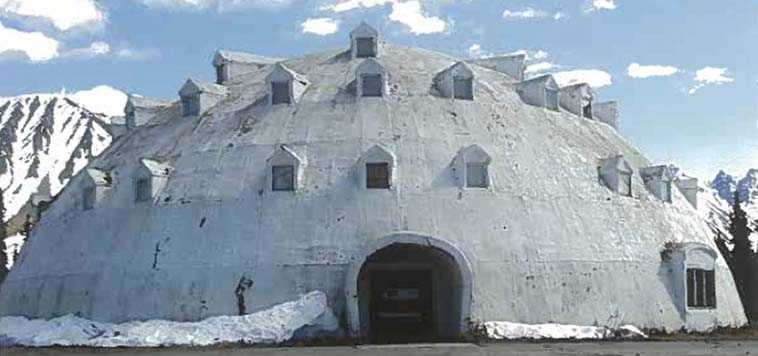 This undated photo provided by Brad Fisher, shows an urethane igloo in Anchorage, Alaska. The igloo, an embodiment of an Alaska cliche, and a must-stop for tourists heading for Denali National Park and Preserve, is for sale. The 80-foot high structure, erected more than four decades and never completed, sits on a 38-acre site, which is part of the sales package. (AP Photo/Brad Fisher)