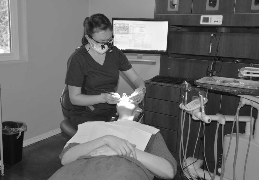Photo by Dan Balmer/Peninsula Clarion Dental Hygienist Ame Nienhuis examines Martha Allgiaer of Sterling at Moose River Dental April 23 in Sterling. Moose River Dental opened on April 14 and is located on the Sterling Highway at the corner of Swanson River Road.