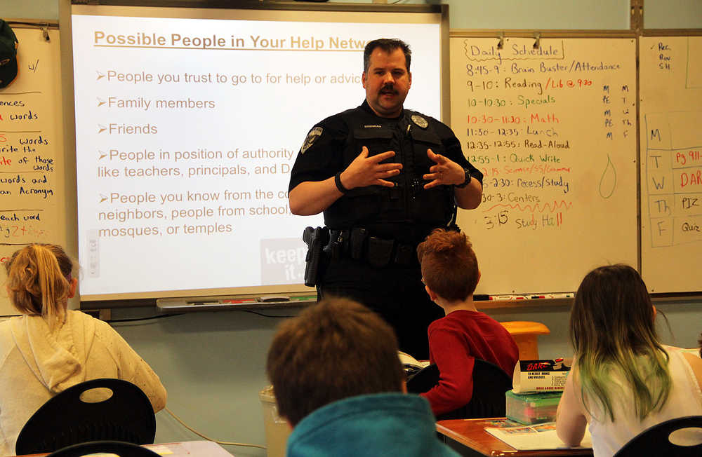 Soldotna police officer Tobin Brennan teaches the last DARE class of the year for Jake Eveland's fifth grade class at Redoubt Elementary School Wednesday. Brennan spoke to the students about the importanace of having a support network.