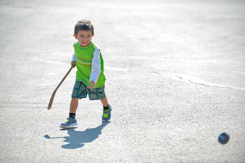 Photo by Rashah McChesney/Peninsula Clarion  Kenzo Cook, 2, of Kenai, plays in the parking lot of The Duck Inn, 43187 Kalifornsky Beach Rd, Wednesday April 30, 2014 in Soldotna, Alaska.