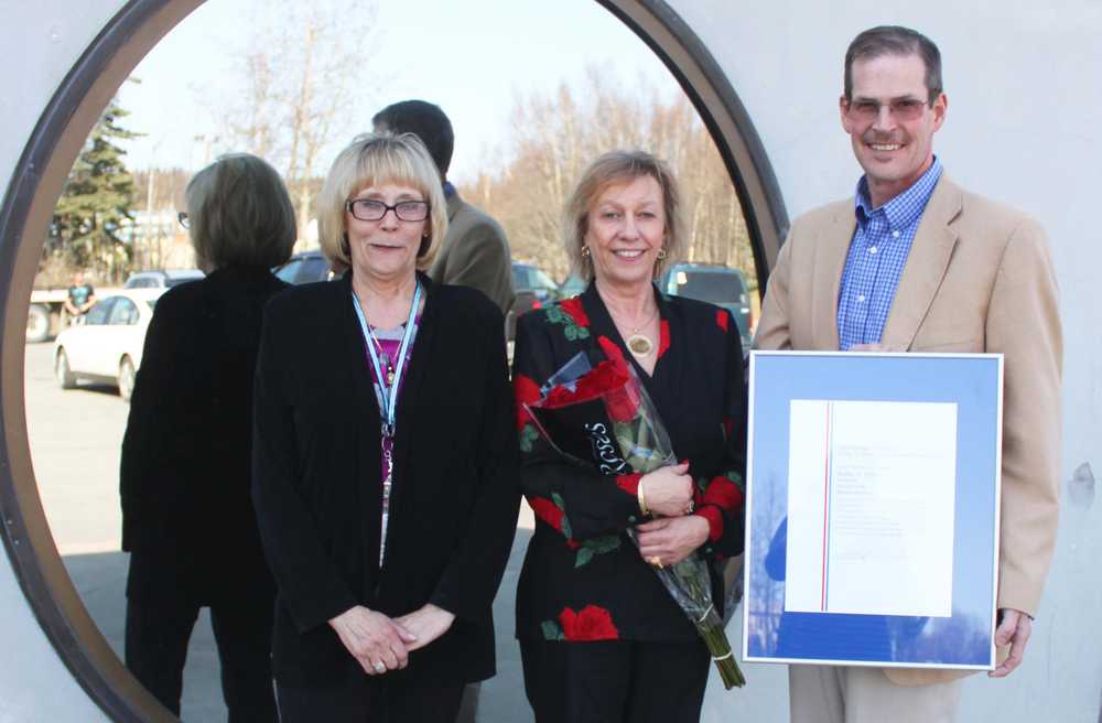 Photo by Kelly Sullivan/ Peninsula Clarion After Robia Bishop's ceremonial installment, Sherrill Behm and Ronald Haberman joined her outside the Post Office, Wednesday, April 30, in Soldotna.