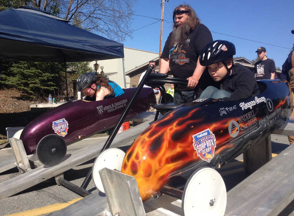 Racers get ready at the starting gate with race director Scott Hamann during the Kenai Rotary Club's Soap Box Derby, held on Spruce Street in Kenai on May 10.