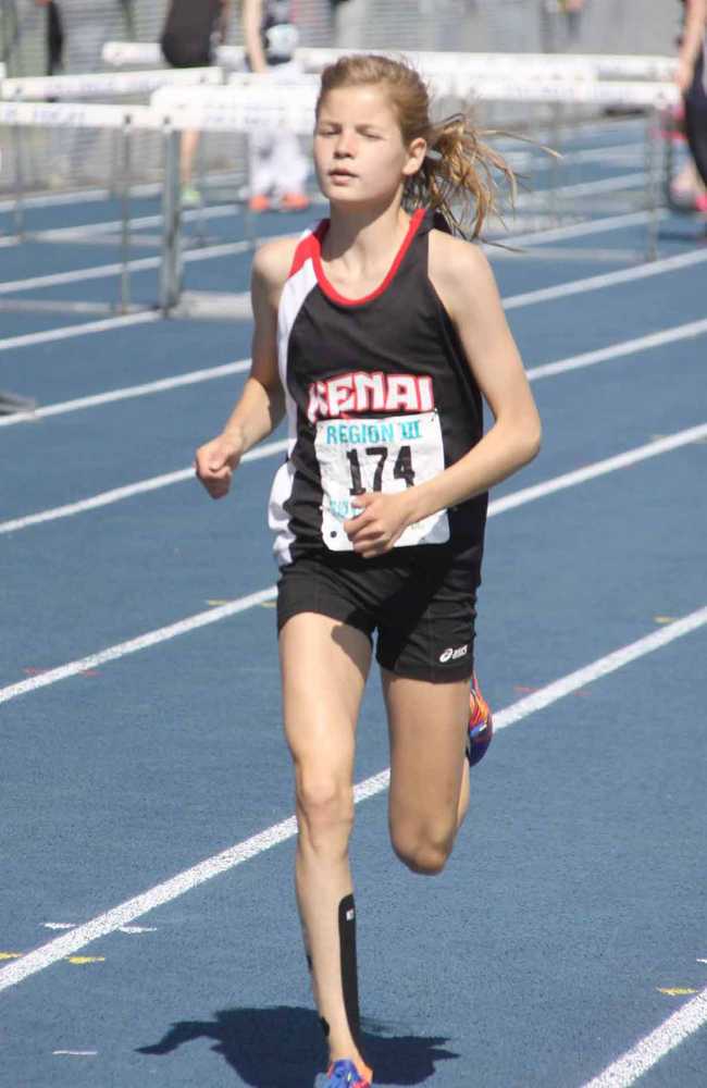 Kenai junior Allie Ostrander set a new Region III record in the girls' 3,200 meters with a time of 10 minutes and 17 seconds during the first day of the region championships May 16 at Palmer High School. Ostrander broke the old mark she set last year, a time of 10:25.