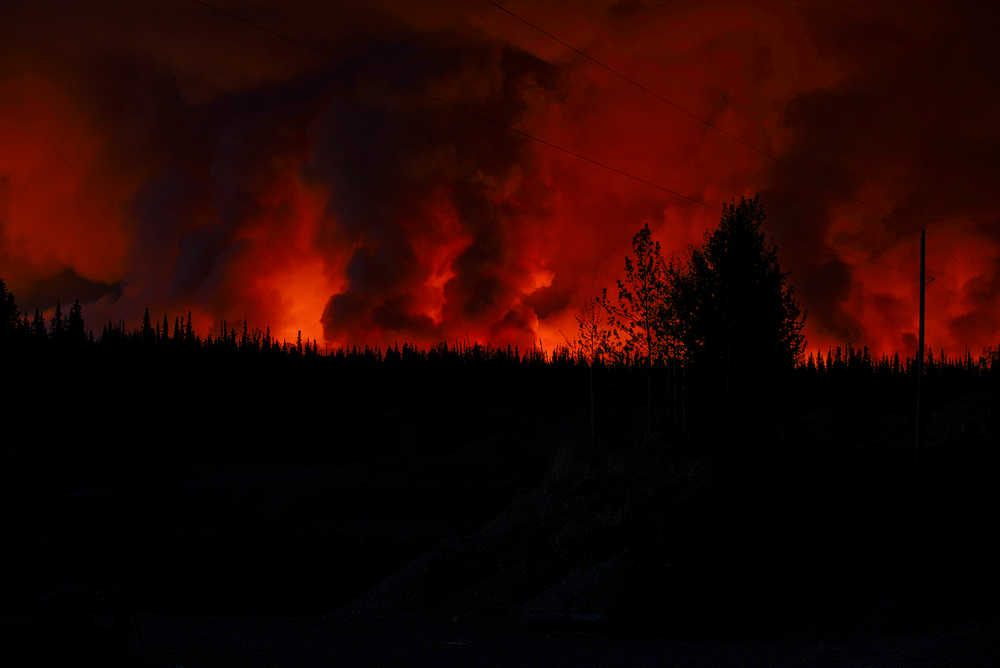 Photo by Rashah McChesney/Peninsula Clarion   The sky above many portions of Kasilof glowed orange Wednesday May 21, 2014 as the Funny River Fire continued to burn a more than 10 mile strip of land stretching from Funny River Road in Soldotna down to Tustumena Lake. Firefighters estimate that more than 20,000 acres have been burned in the blaze.