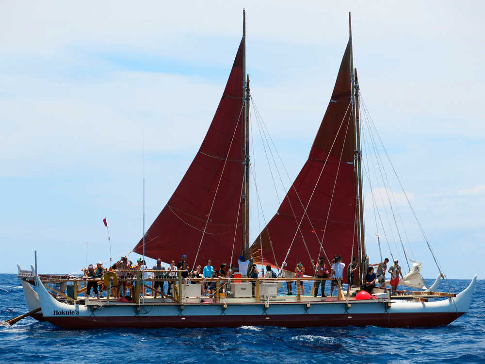 The Hokulea sailing canoe is seen off Honolulu on Tuesday, April 29, 2014. The Polynesian voyaging canoe is setting off on a 3-year voyage around the world, navigating using no modern instrumentation. (AP Photo/Sam Eifling)