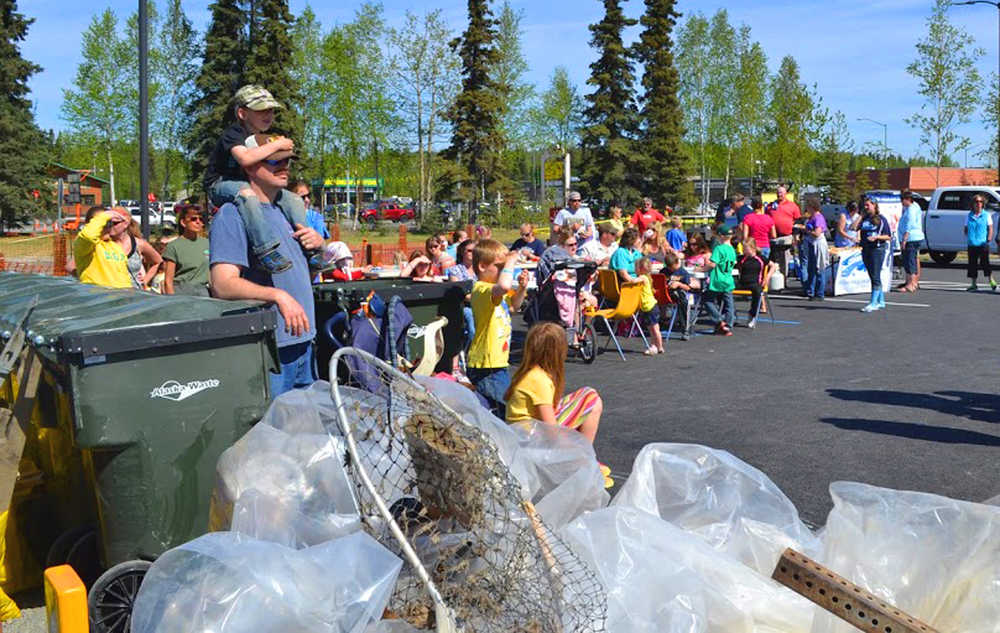 Photo courtesy Keith Baxter Friends and family who cleaned up the banks during the first annual Kenai River Spring Cleanup week, listen to the results of the groups, schools and individuals that picked up the most pounds of trash at the culminating barbecue and weigh-in, Saturday, May, 17, at Soldotna Creek Park.