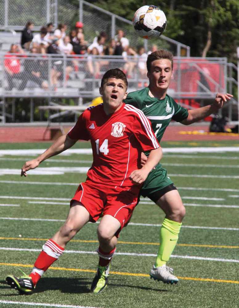Kenai's Chris Hamilton and Colony's Ben Sande battle for possession during the second half of Colony's 3-2 overtime win over the Kardinals in the Northern Lights Conference Championships semifinals May 23 at Wasilla High School.