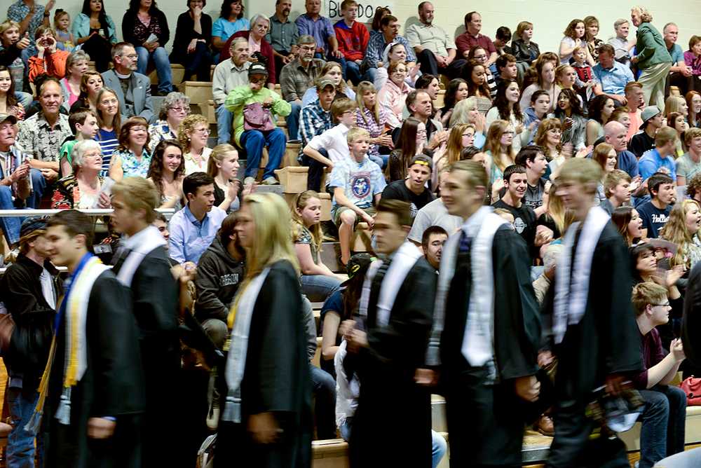 Photo by Rashah McChesney/Peninsula Clarion  A crowd cheers wildly for the newly graduated class of 2014 Nikiski Middle-High School students Monday May 20, 2014 in Nikiski, Alaska.