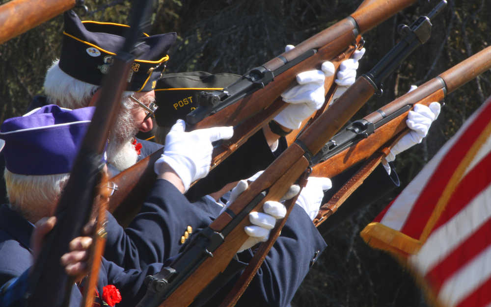 Photo by Kelly Sullivan/Peninsula Clarion Local veterans fired the gun salute in the Soldotna Community Memorial Park ceremony, Monday, May 26, in Soldotna.