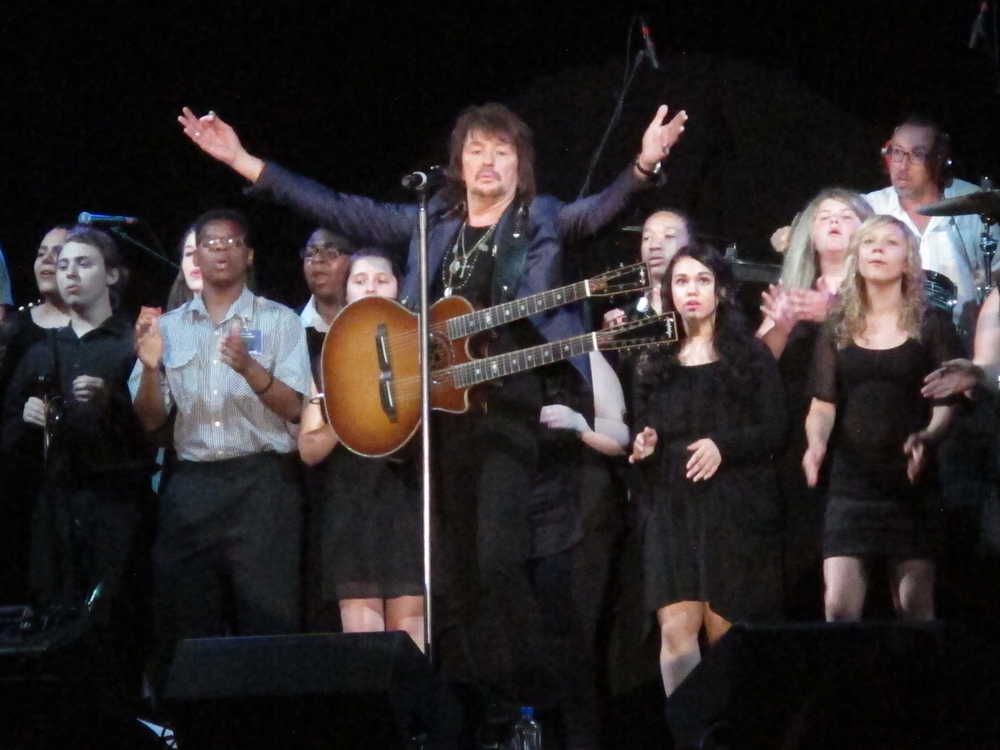 Bon Jovi guitarist Richie Sambora performs a new song, "Lighthouse" at an anti-drug forum in Toms River N.J. on May 27, 2014. The song will raise money for a drug treatment center in New Jersey.(AP Photo/Wayne Parry)