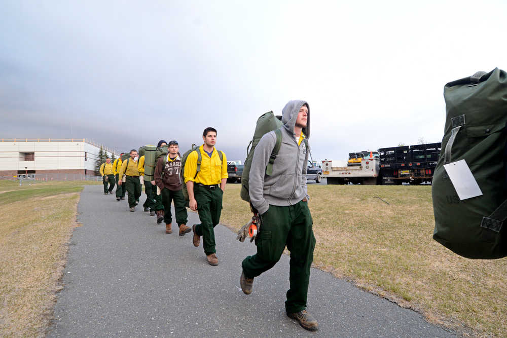 Photo by Rashah McChesney/Peninsula Clarion A firefighting crew from Delta Junction Alaska arrives to set up camp at Skyview High School May 26, 2014 in Soldotna, Alaska. More than 600 people are on the Central Kenai Peninsula fighting the Funny River Horse Trail wildfire which has burned more than 170,000 acres of Kenai National Wildlife Refuge land.