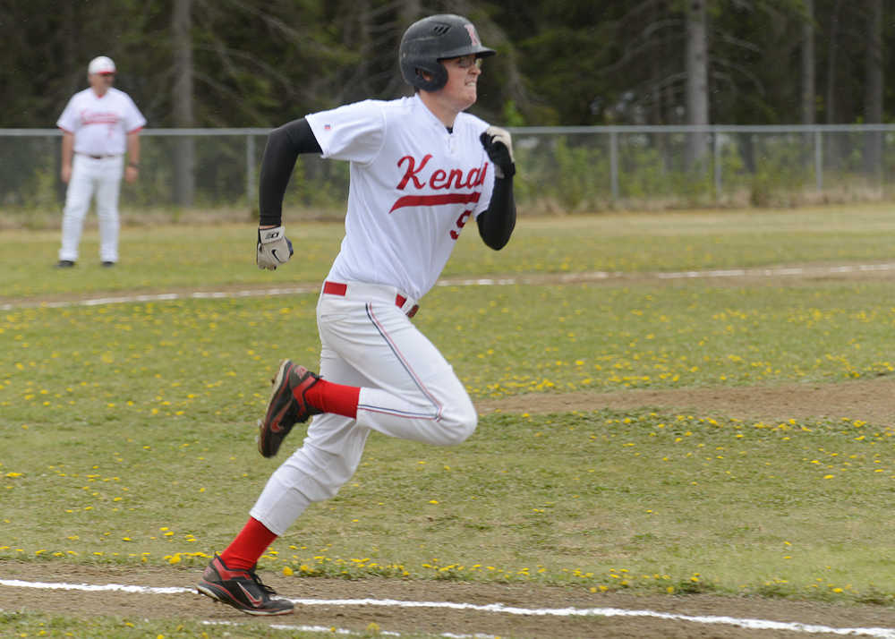 Photo by Rashah McChesney/Peninsula Clarion Kenai's Gabe Boyle heads for first base during their game against Colony Thursday May 29, 2014 during the Northern Lights Conference in Soldotna, Alaska.