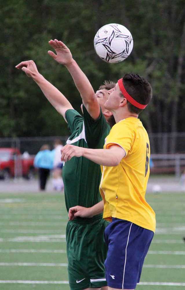 Colony's Cameron Shaw and Homer's Kaec Brinster both go up for the ball during the second half of Colony's 1-0 win over Homer in the ASAA state semifinals May 30 at Anchorage Football Stadium.