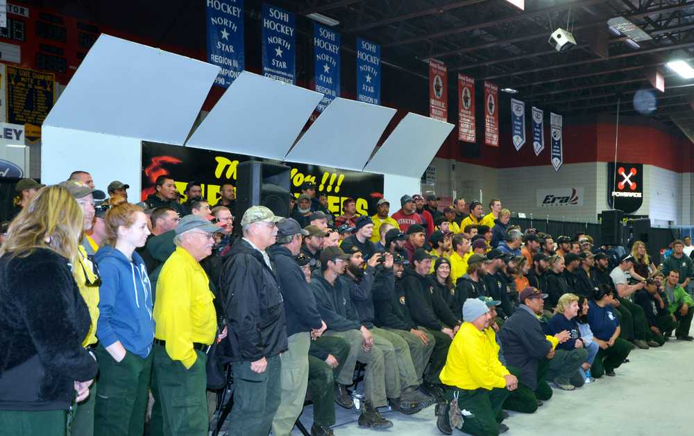 Photo by Dan Balmer/Peninsula Clarion Firefighters involved in containing the Funny River Horse Trail wildfire gather for a photo at the appreciation dinner Sunday at the Soldotna Regional Sports Complex. More than 700 firefighters from Alaska, Canada, Oregon and Montana have battled the blaze since it began on May 19.
