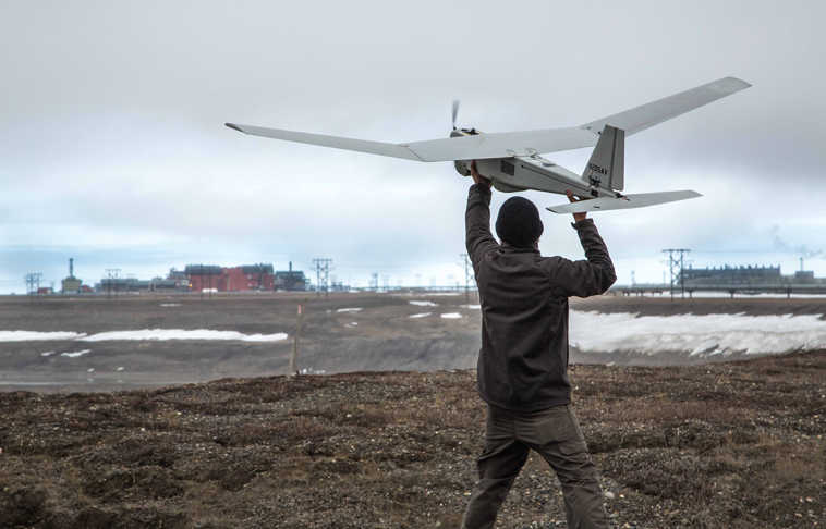 In this photo taken Saturday, June 7, 2014, and released by BP Alaska, Unmanned Aerial System (UAS) technology using an AeroVironment Puma drone is given a pre-flight checkout in preparation for flights by BP at its Prudhoe Bay, Alaska operations. The Federal Aviation Administration said Tuesday it has granted the first permission for commercial drone flights over land, the latest effort by the agency to show it is loosening restrictions on commercial uses of the unmanned aircraft. Drone maker AeroVironment of Monrovia, California, and BP energy corporation have been given permission to use a Puma drone to survey pipelines, roads and equipment in Alaska, the agency said. The first flight took place on Sunday. (AP Photo/BP Alaska)