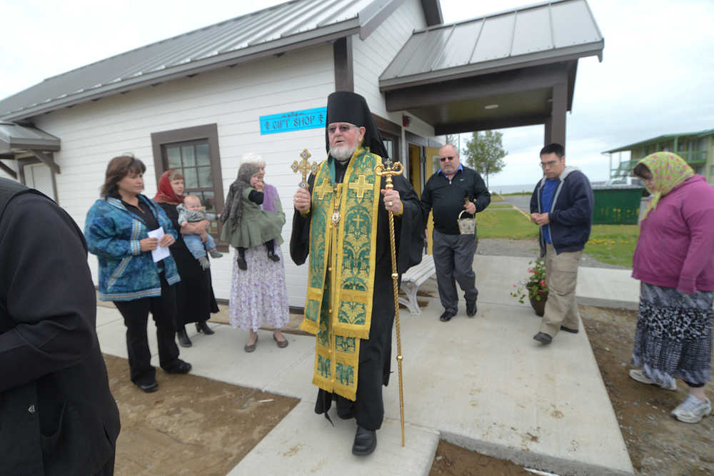 Photo by Rashah McChesney/Peninsula Clarion   Bishop David Mahaffey finishes up the rear of a procession at the end of his blessing on a new outbuilding at the Holy Assumption of the Virgin Mary Russian Orthodox Church Thursday June 12, 2014 in Kenai, Alaska.