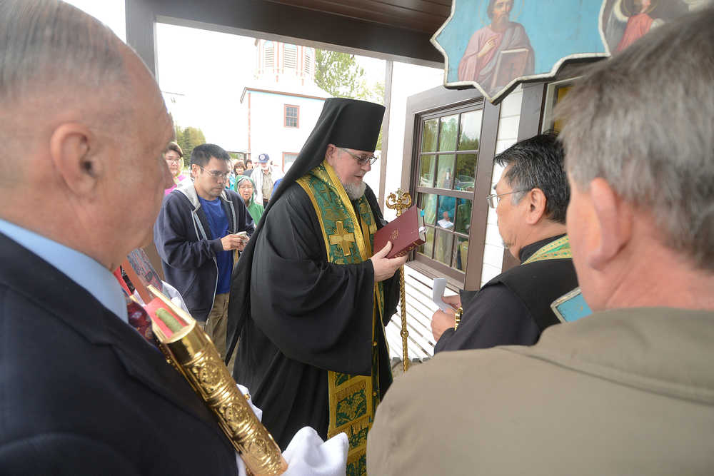 Photo by Rashah McChesney/Peninsula Clarion   Bishop David Mahaffey prepares to intone a biblical passage during his blessing on a new outbuilding at the Holy Assumption of the Virgin Mary Russian Orthodox Church Thursday June 12, 2014 in Kenai, Alaska.