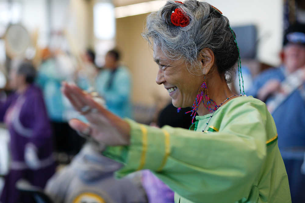 Photo by Rashah McChesney/Peninsula Clarion Nancy Shephard, of Dillingham, dances with the Mount Susitna drummers and singers during the second day of grand opening festivities Friday June 13, 2014 at the Dena'ina Wellness Center in Kenai, Alaska.