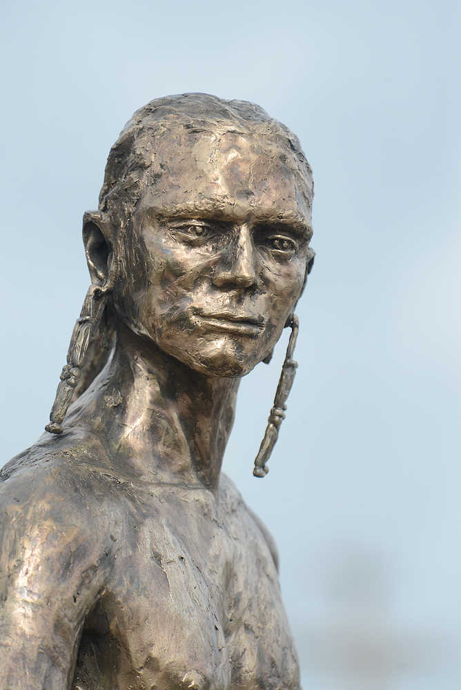 Photo by Rashah McChesney/Peninsula Clarion  A bronze statue of a Dena'ina fisherman, crafted by Soldotna-native Joel Isaak, was unveiled outside of the Kenaitze Indian Tribe's Dena'ina Wellness Center Friday June 13, 2014 in Kenai, Alaska.