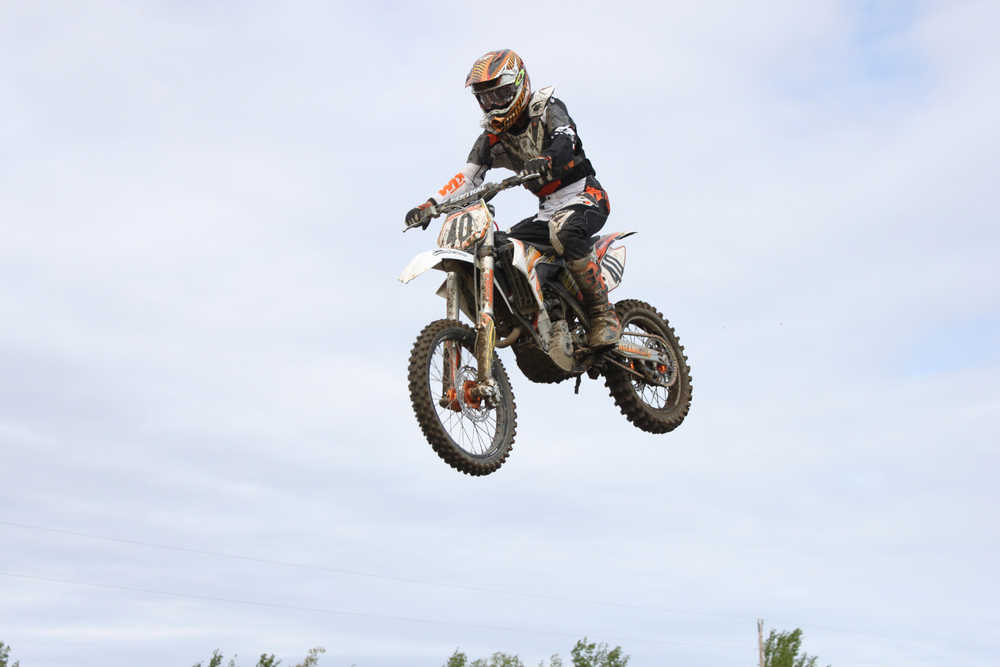 Photo by Kelly Sullivan/ Peninsula Clarion A rider takes a jump during the State Races, Saturday, at Twin City Raceway.