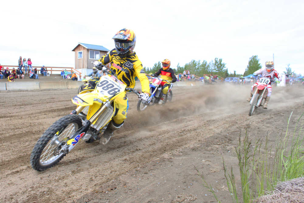 Photo by Kelly Sullivan/ Peninsula Clarion Racers right off the jump at the State Races, Saturday, at Twin City Raceway.