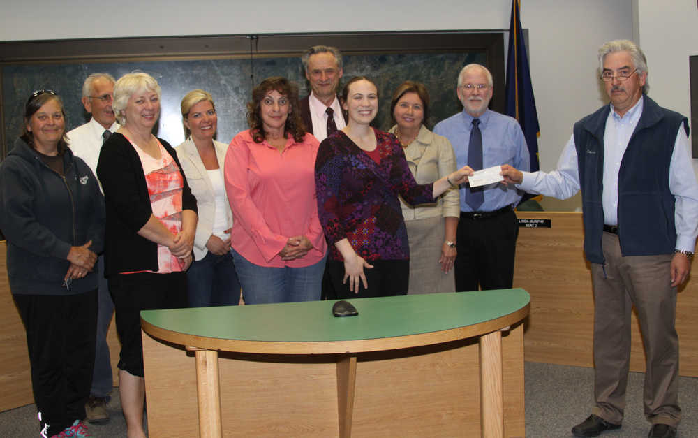 Soldotna Friends of the Library present the City with a check for $21k