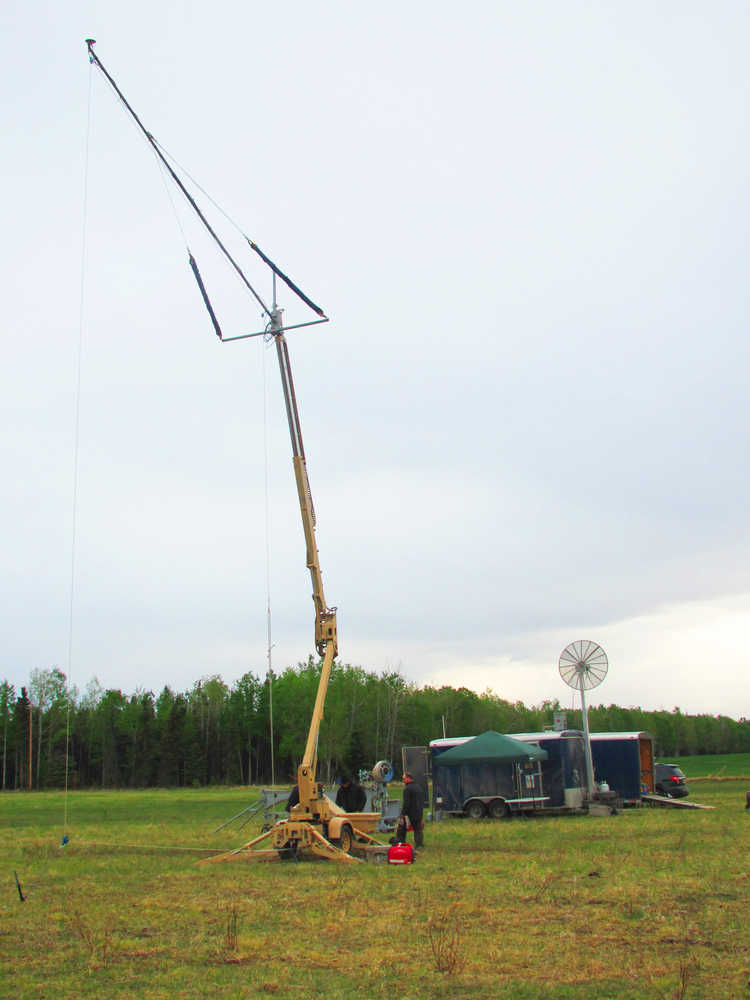 Photo courtesy Matt Parker Because of the low altitude of the deployment site for the Insitu ScanEagle, the teams hoisted the remote for the GPS onto a Hydraulic Crane for better leverage outside of the Funny River Fire in Funny River.