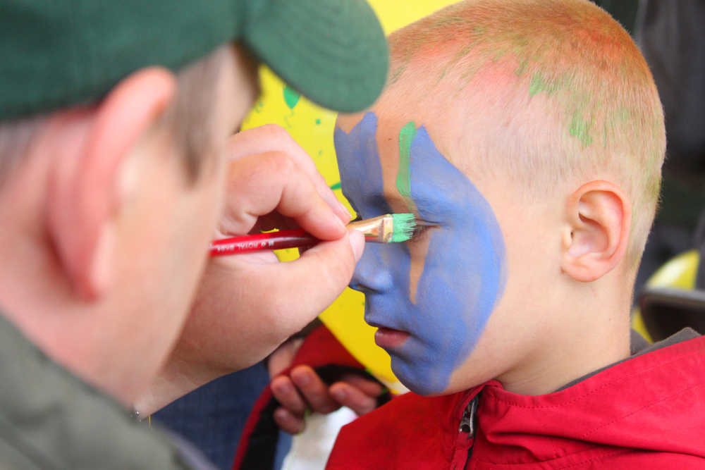 Photo by Kelly Sullivan/Peninsula Clarion Ben Jennings chose to have his face painted blue and green at the Frontier Community Services World Series Baseball event, Saturday, June 22.