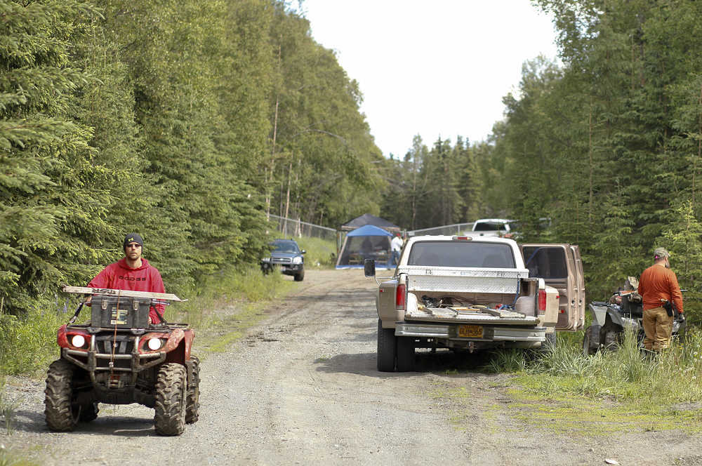 Photo by Rashah McChesney/Peninsula Clarion Volunteers on four-wheelers, horses, on foot and in an airplane combed a section of the woods near an apartment rented by a missing Kenai family Tuesday June 24, 2014 in Kenai, Alaska. The family has been missing since late May.