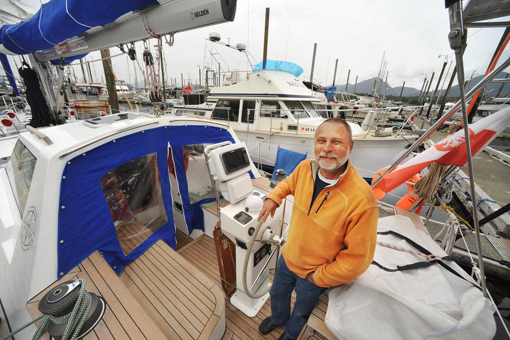 Ryszard Wojnowski stands at the helm of his 47-foot steel hulled sailboat, Lady Dana 44, at Bar Harbor in Ketchikan, Alaska on June 19, 2014. The boat has a reinforced hull for its trip around the North Pole and navigational hazards with ice floes. The Polish engineer and recreational sailor is on a year-long voyage around the arctic. (AP Photo/Ketchikan Daily News, Hall Anderson)