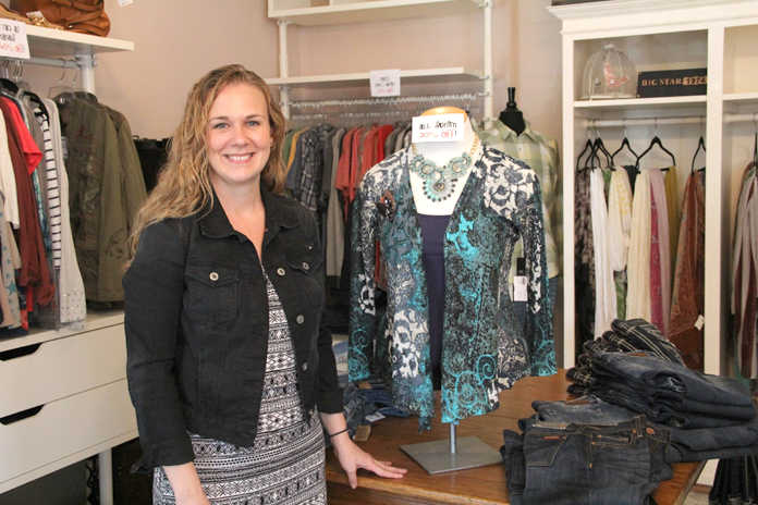 Tammy Davis, owner of Chez Moi Boutique, stands in her store on Tuesday at Shops Around the Corner in Soldotna. Davis, who has run Chez Moi in Soldotna for seven years, opened the store in the new space in April. Photo by Kaylee Osowski/Peninsula Clarion