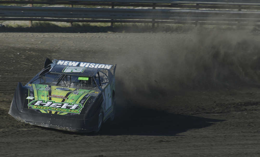Photo by Rashah McChesney/Peninsula Clarion Mike Braddock rounds a curve during a stock car race Friday July 4, 2014 at the Twin Cities raceway in Kenai, Alaska.