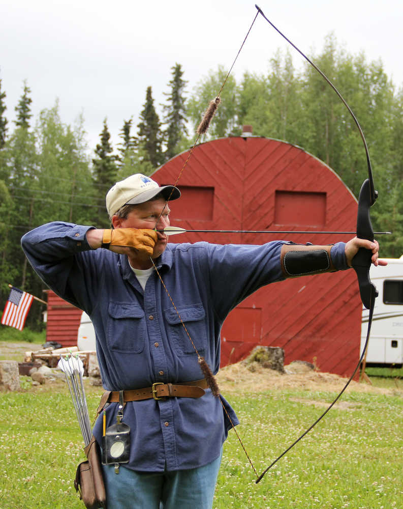 Photo by Dan Balmer/Peninsula Clarion Kenai resident John Lindgren takes aim with his traditional longbow at the Independence Day Marked 3-D Archery Tournament Sunday at the Kenai Peninsula Archery Range in Soldotna. Lindgren won the traditional division with 670 points accumulated from 45 targets over the two-day tournament.