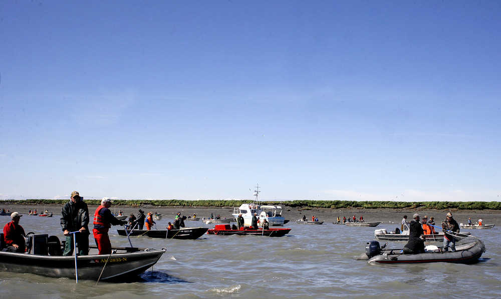 Dipnetters fish for sockeye salmon from boats near the mouth of the Kenai River Monday.