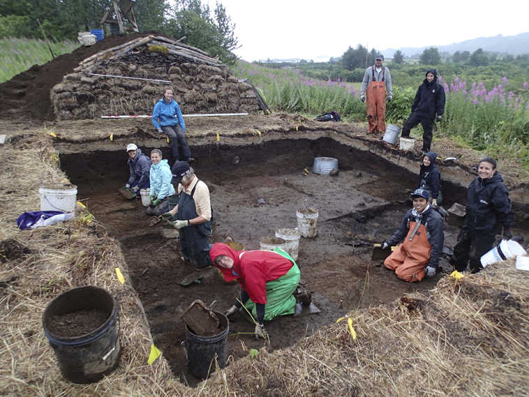 This August 2013 image provided by the Alutiiq Museum volunteers working alongside Alutiiq Museum staff to uncover a sod house occupied 400 years ago by an Alutiiq family on Kodiak Island, Alaska.  The Alutiiq Museum in Kodiak is preparing for its 17th annual community archaeology dig, where nonprofessionals can participate in real research at an actual excavation site.(AP Photo/Alutiiq Museum)