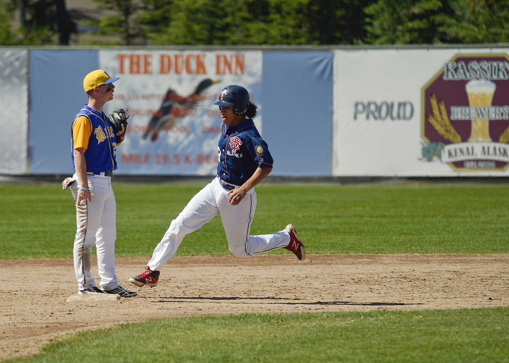 Photo by Rashah McChesney/Peninsula Clarion  Twins' Dallas Pierren rounds second base during a game against Bartlett Saturday July 19, 2014 in Kenai, Alaska.