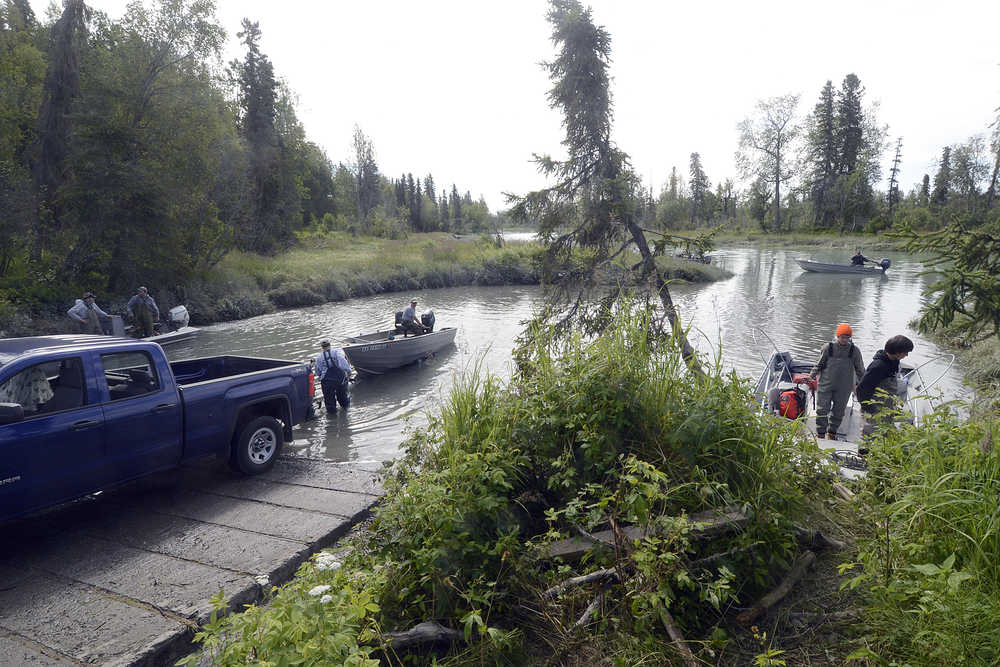 Photo by Rashah McChesney/Peninsula Clarion  The Eagle Rock boat launch saw moderately heavy use, primarily by personal-use fishermen launching to head downstream and fish Friday July 18, 2014 in Kenai, Alaska. The Alaska Department of Natural Resources - Division of Parks and Outdoor Recreation took over managment and operations of the boat launch and 2014 is its first season being state run.