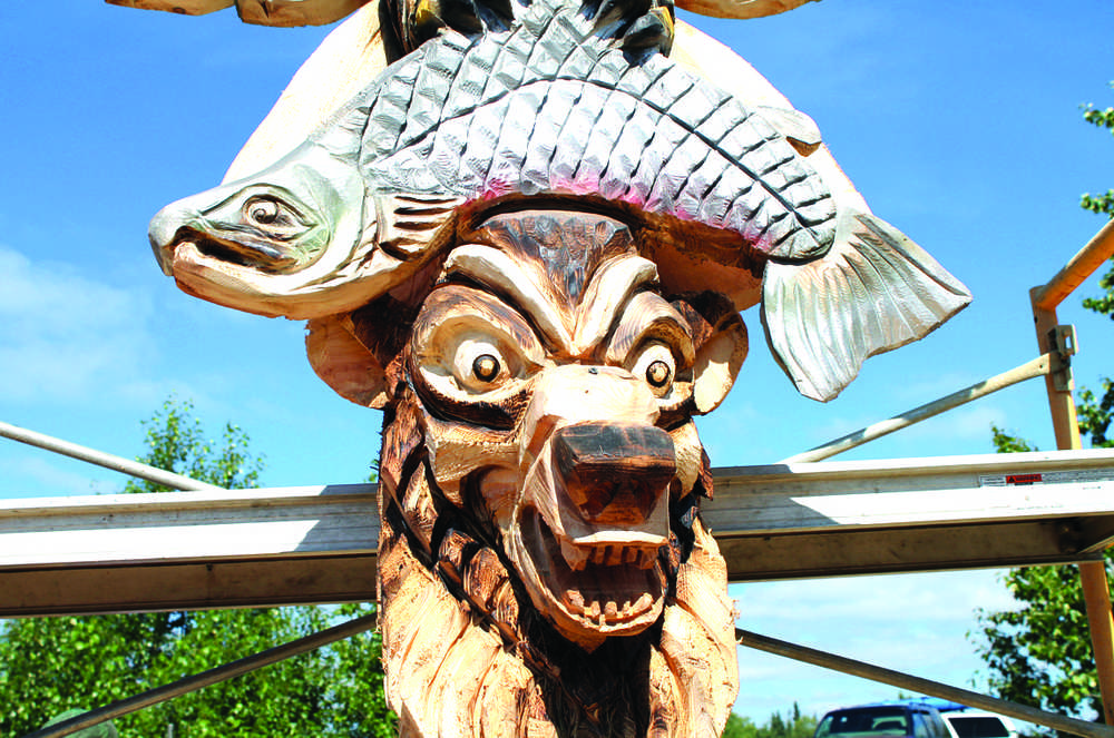 A close up view of Scott Hanson's Alaska animal totem pole carved over four days during Progress Days.