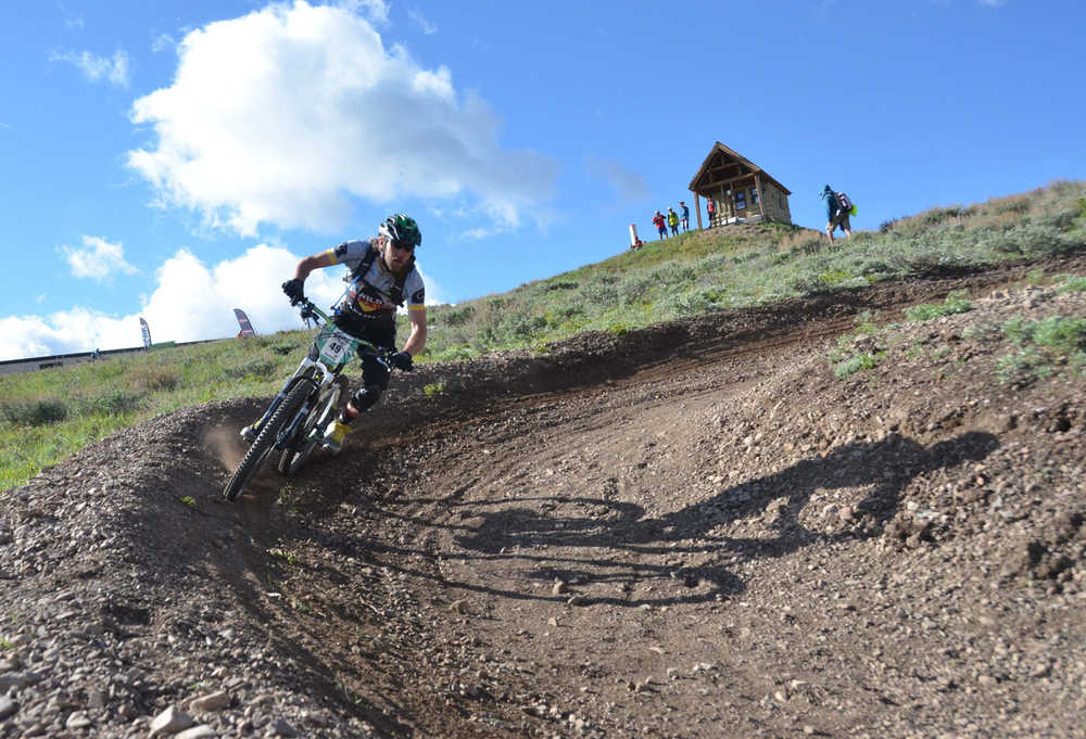 In this July 2014 photo, Mike Wieser of Boise, Idaho rides Sun?Valley, Idaho's newest flow trail, Saddle Up, during a race at the ski resort. Sun?Valley's trails and lifts are open to cyclists for the summer. (AP Photo/The Idaho Statesman, Roger Phillips)