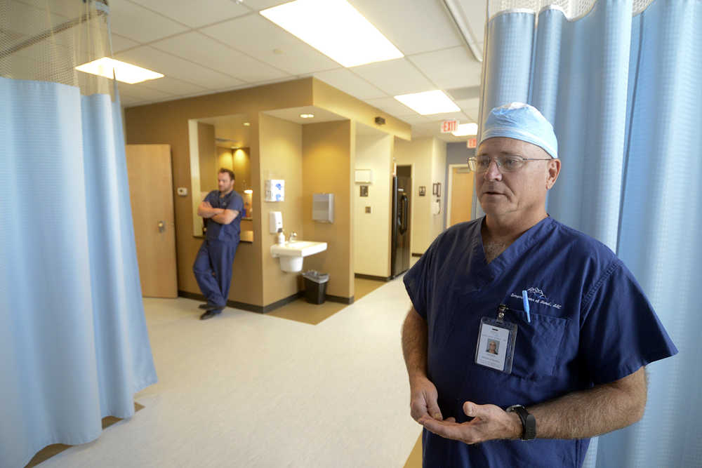 Photo by Rashah McChesney/Peninsula Clarion  Tom Wilkinson, director of nurses, talks about surgical recovery rooms while Jake Savely, surgical tech listens during a tour of the Surgery Center of Kenai, LLC., Tuesday July 22, 2014 in Kenai, Alaska.