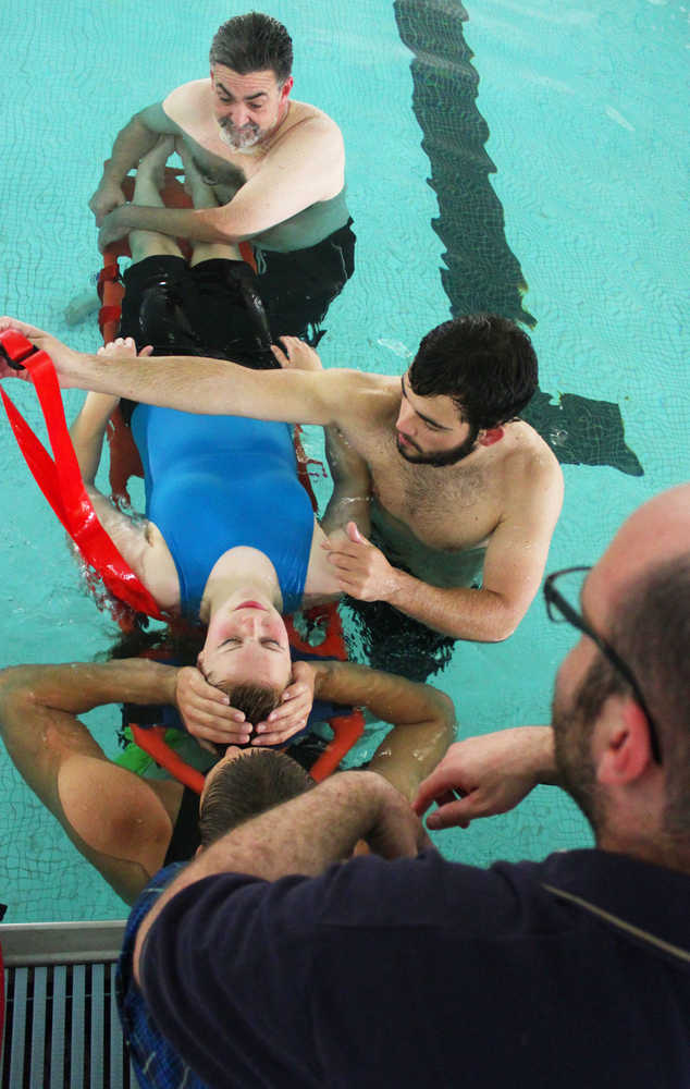 Photo by Kelly Sullivan/ Peninsula Clarion A Nikiski lifeguard sweatshirt sits on the side of the pool during a training class, June 30, at the Nikiski Pool.