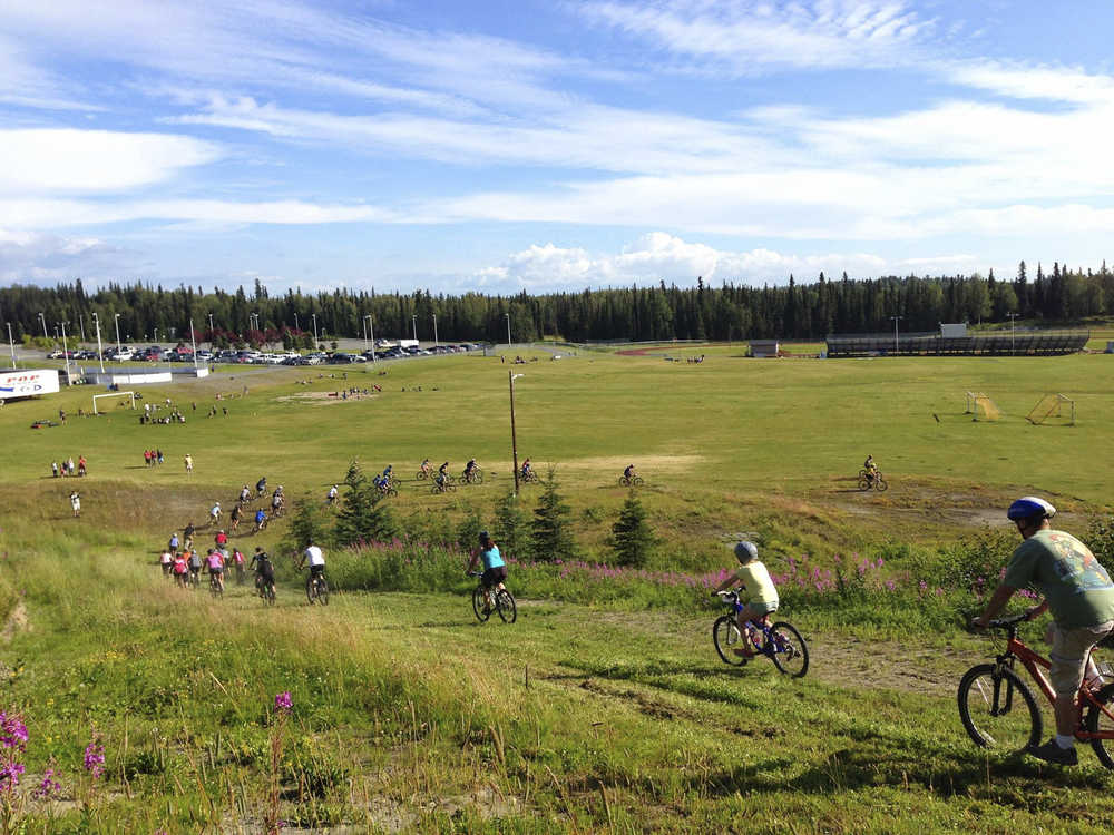 Contributed photo by Tsalteshi Trails Association The trails was packed during the fourth Salmon Cycle Series race Thursday July 31, 2014 on the Tsalteshi Trails in Soldotna, Alaska.