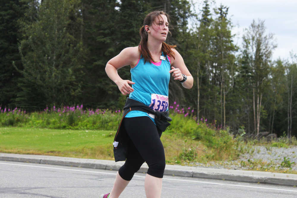 Photo by Kelly Sullivan/ Peninsula Clarion Cassie Collins said the Women's Run 10k was her first 10k race ever, and she came in ten minutes faster that she predicted, Saturday, August 9, 2014, at the Kenai Park Strip, Kenai, Alaska.